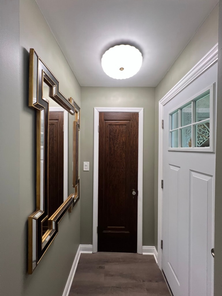 Hallway with gold-framed mirrors